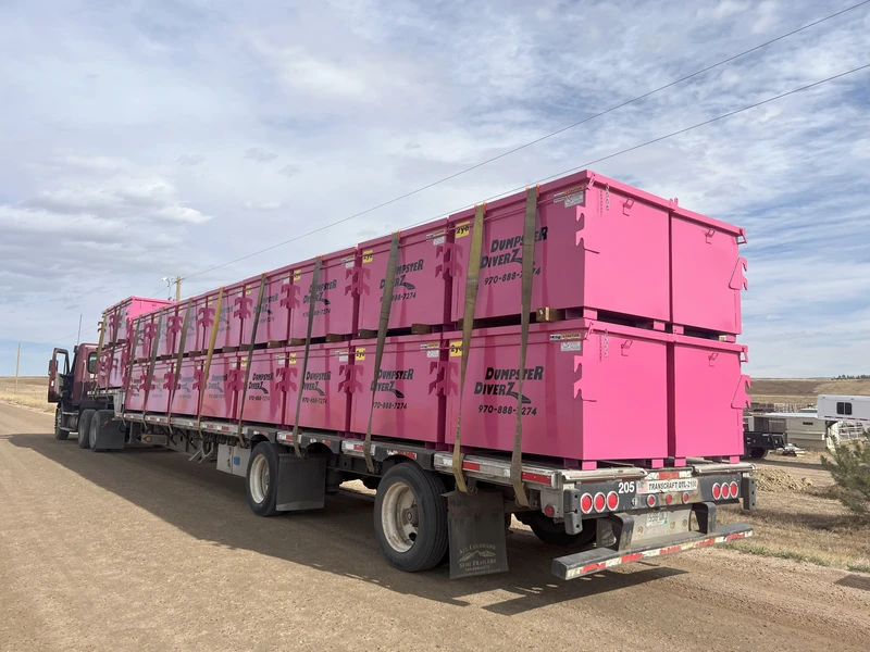 Commercial dumpster behind an office in Fort Collins, Colorado, ready for pickup by Dumpster Diverz